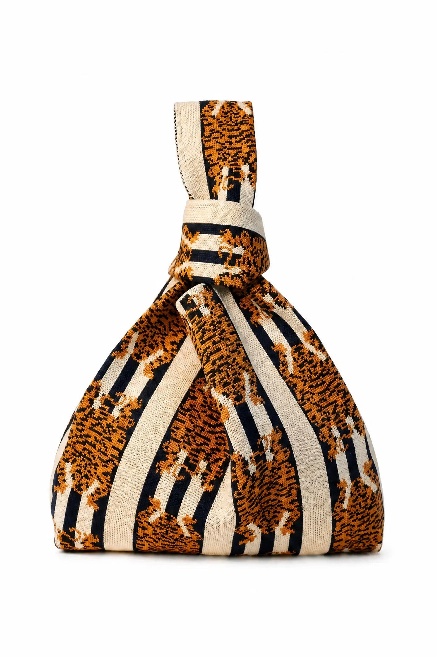 A knotted fabric bag featuring a bold pattern of orange and black leopard print mixed with vertical cream and black stripes, set against a plain white background.