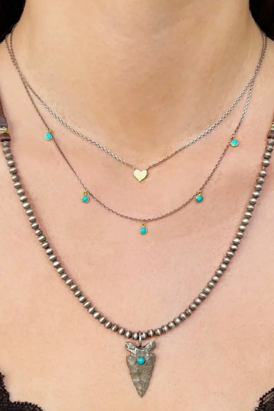 CLP Jewelry - 14k Tiny Gold Heart On Delicate
Sterling Silver Chain