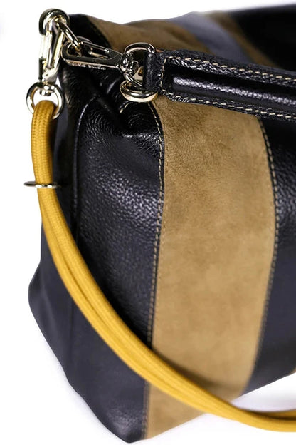 Black and brown handbag with a yellow strap on a white background